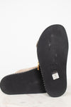 Black sole of a sandal with 'Chloe' branding on a white background