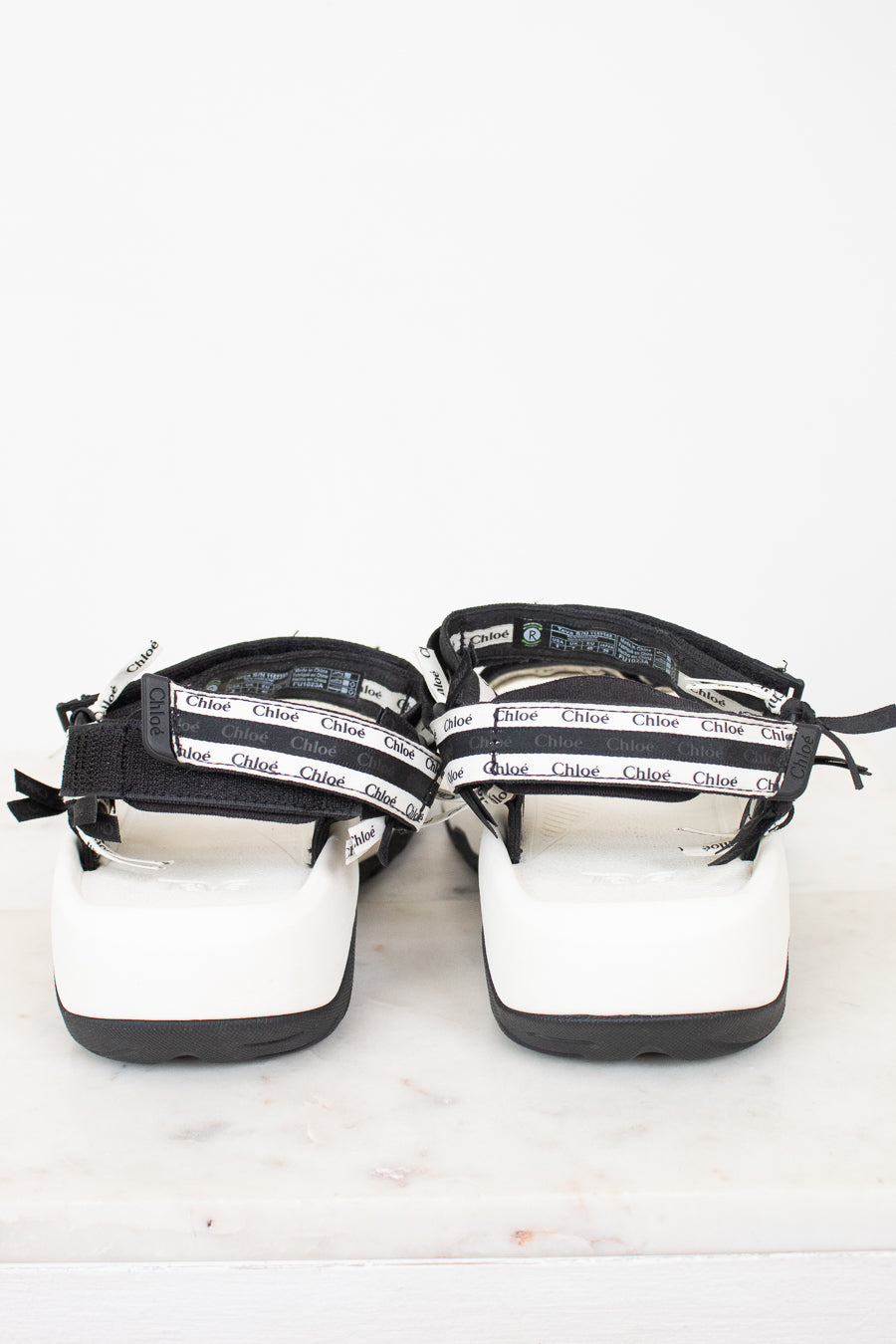 Back view of black and white 'Chloe' sandals