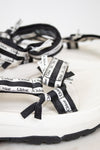 Close up of black and white 'Chloe' sandals