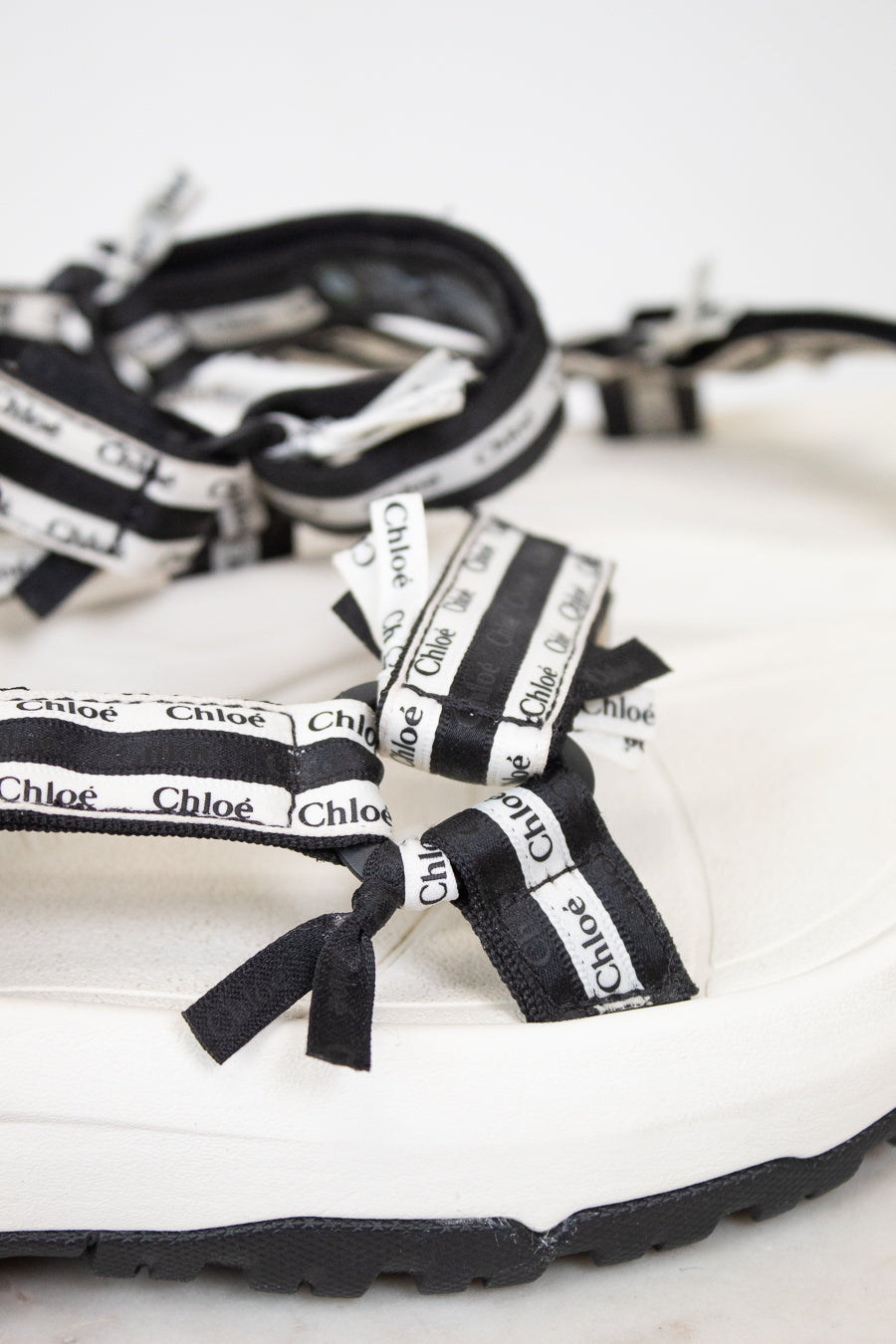 Close up of black and white 'Chloe' sandals