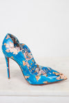 Blue high-heeled shoe with a colorful pattern on a white background