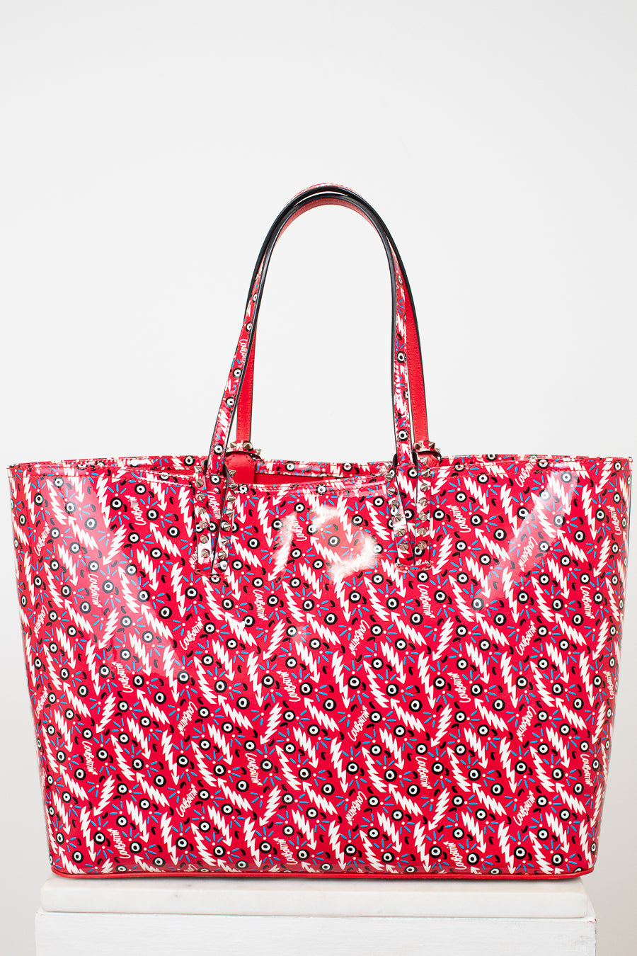 Red patterned tote bag on a white background
