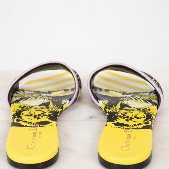 Close up of yellow and black patterned insole of flat sandals