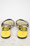 Close up of yellow and black patterned insole of flat sandals