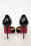 Black high-heeled shoes with red soles on a white background
