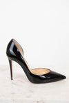 Black patent high-heeled shoe on a light background