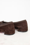 Heel view of brown suede ballet flats