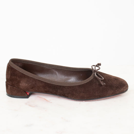 Side view of brown suede ballet flats