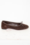 Side view of brown suede ballet flats