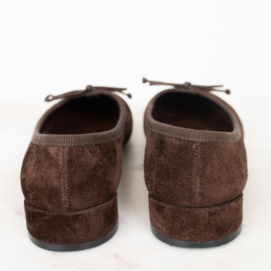 Heel view of brown suede flats