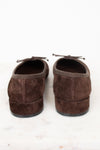 Heel view of brown suede flats