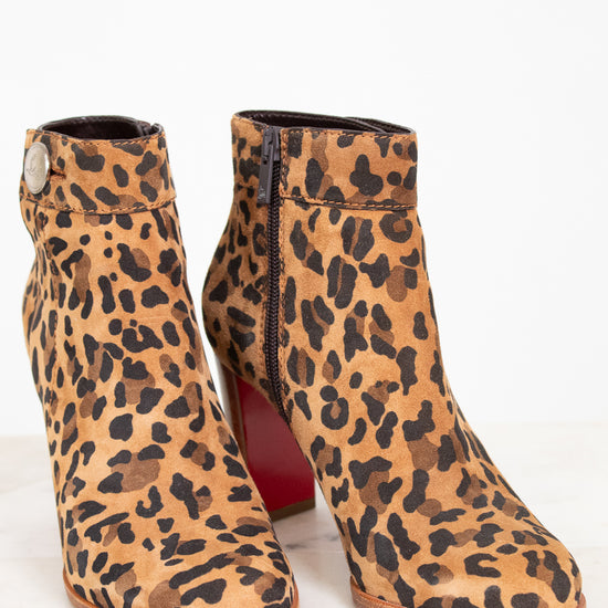 Leopard print ankle boots on a white background