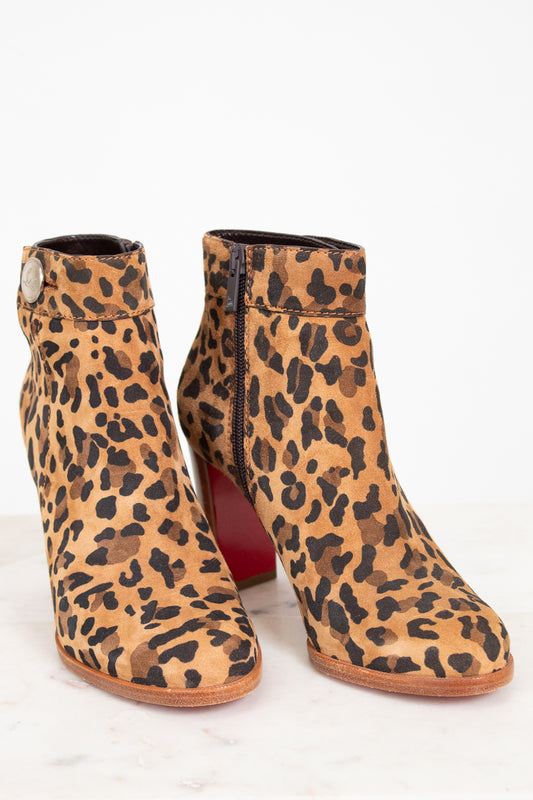 Leopard print ankle boots on a white background
