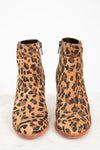 Pair of leopard print ankle boots on a white background