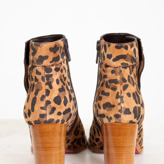 Leopard print ankle boots on a white background