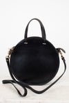 Black handbag with gold accents on a white background