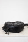 Black quilted bag on a white background