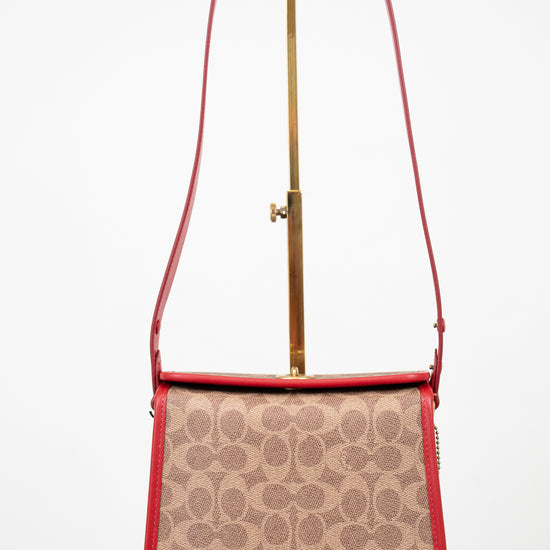Handbag with red strap and beige pattern on a white background