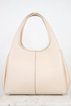 Back view of a  light beige leather shoulder bag  displayed on a light marble surface against a white background.