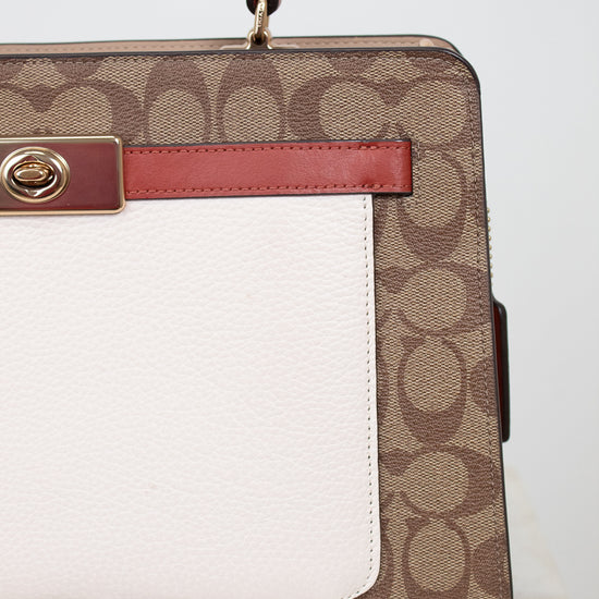 Handbag with brown and white pattern on a light background