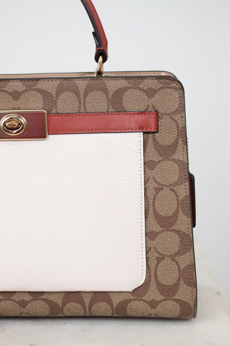 Handbag with brown and white pattern on a light background
