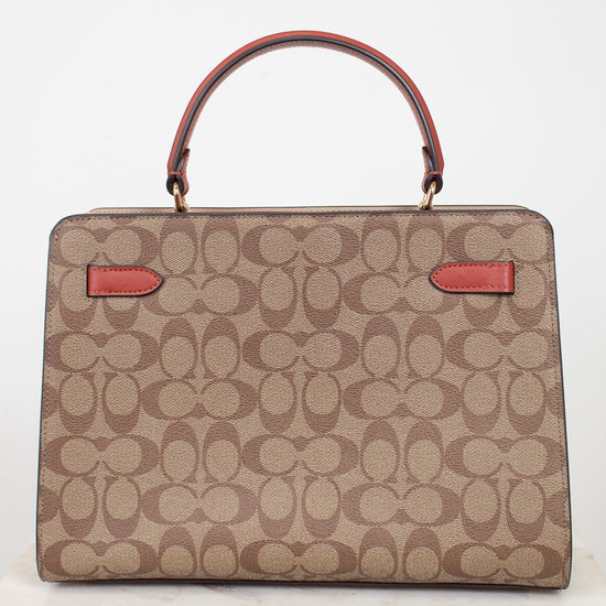 Beige handbag with red accents on a white background