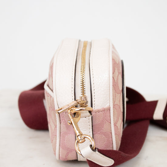 Small bag with a gold zipper and clasp on a marble surface