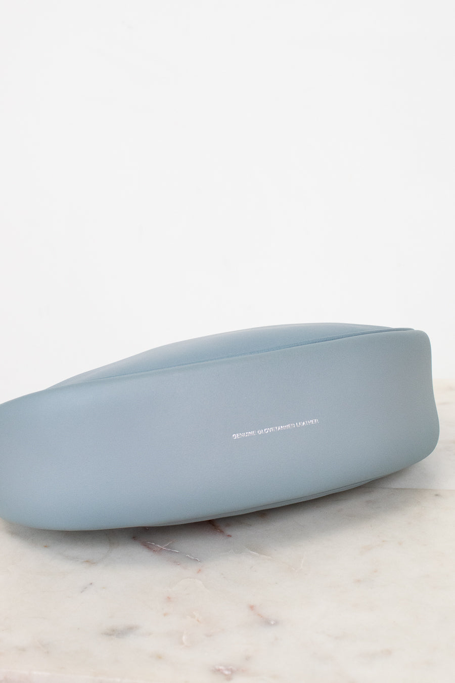 Bottom of light blue handbag