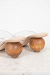 Shoe with wooden spherical heel on a light background