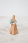 Turquoise squared center stone with gold and diamond border with side stamp detail