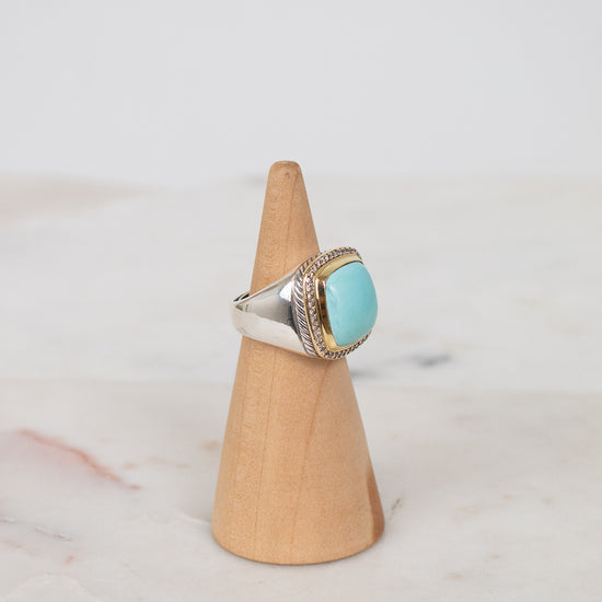 Turquoise squared center stone with gold and diamond border details