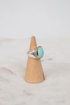 Turquoise squared center stone with gold and diamond border details