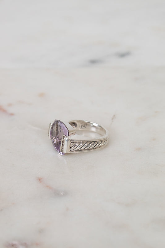 Squared amethyst center stone with diamond side panel and silver cable band details