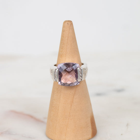 Squared amethyst center stone with diamond side panel details