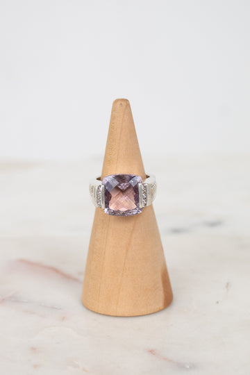 Squared amethyst center stone with diamond side panel details