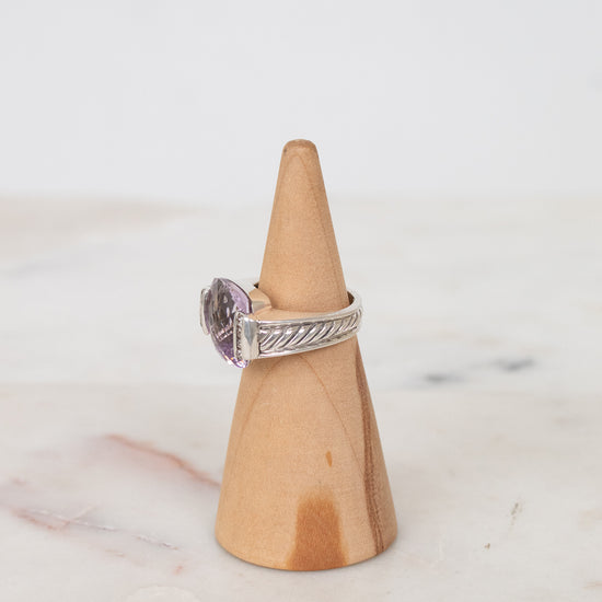 Squared amethyst center stone with diamond side panel and cable band detail
