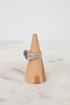 Squared amethyst center stone with diamond side panel and cable band detail
