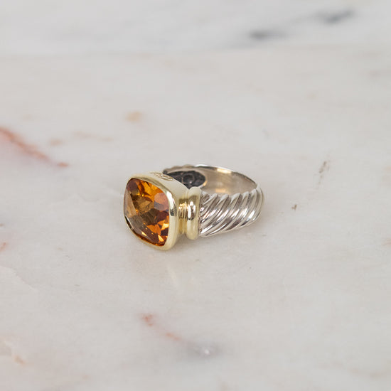 Side view of citrine stone and visible silver and gold hardware