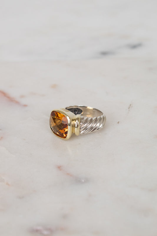 Side view of citrine stone and visible silver and gold hardware