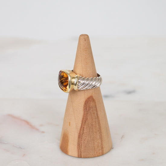 Side view of citrine stone and visible silver and gold hardware