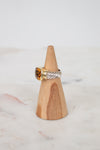 Side view of citrine stone and visible silver and gold hardware