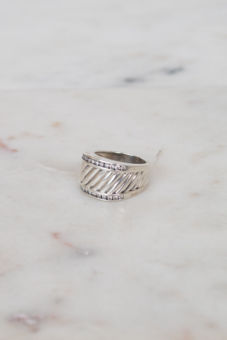 Silver cable band ring with diamond border details