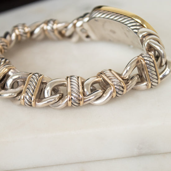 Close-up of gold and silver watch band