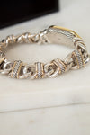 Close-up of gold and silver watch band