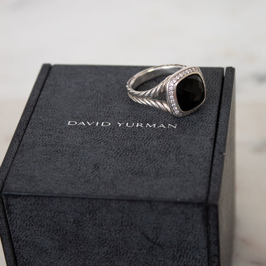 Silver ring on a David Yurman box