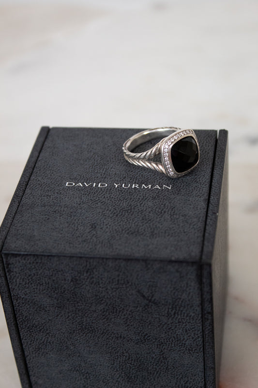 Silver ring on a David Yurman box