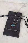David Yurman necklace with blue gemstone on a branded pouch