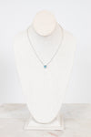 Necklace with a blue center detail on a mannequin against a white background
