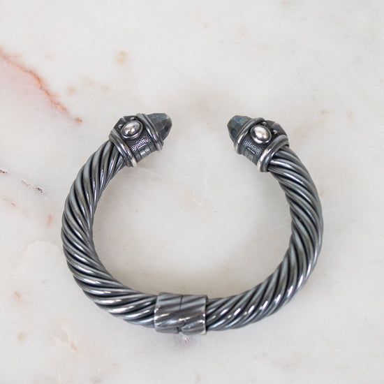 Silver bracelet with on a marble surface