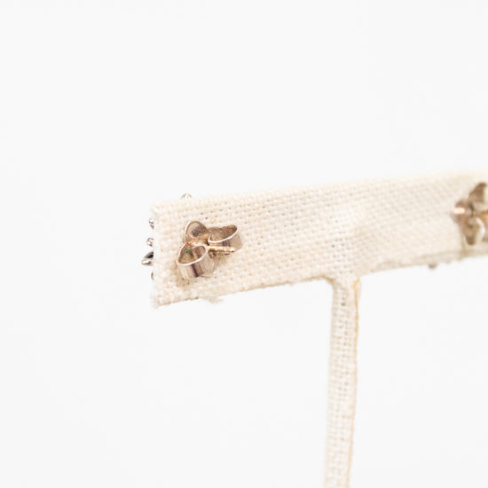 Earring post close up on stand with a white background